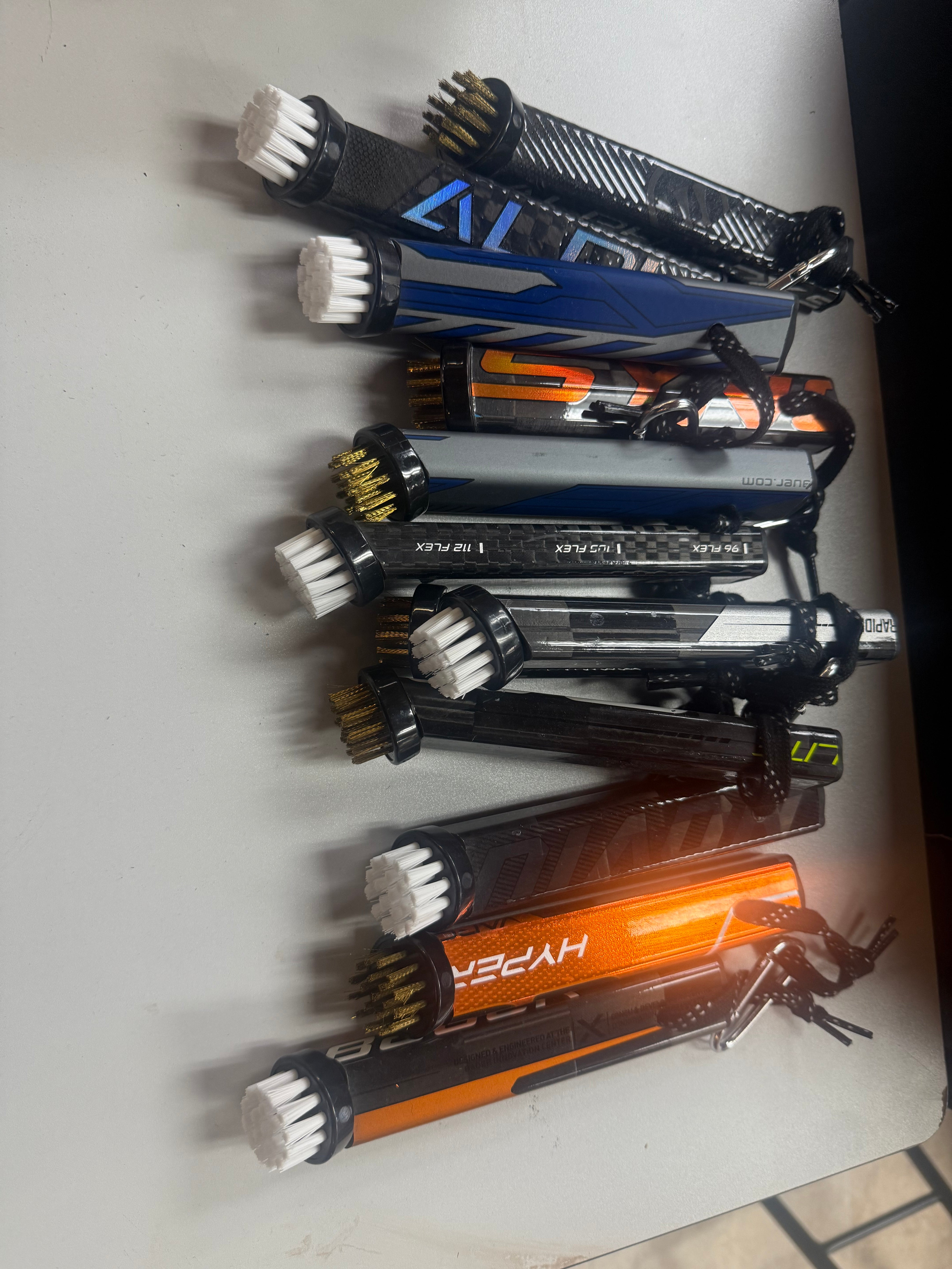 Requipped golf brush repurposed hockey sticks